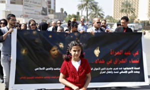 A demonstration against the draft of the "Al-Jafaari" personal status law. The sign reads, "Women ar