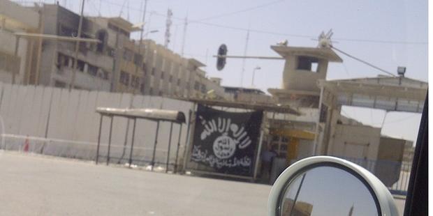 The black flag of Jihad used by the Islamic State of Iraq and al-Sham in Mosul.