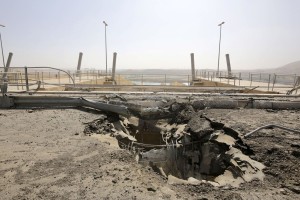 A crater at the Mosul Dam's entrance is evidence of the fight for control of the key resource between Kurdish and Iraqi forces and the Islamic State militants.