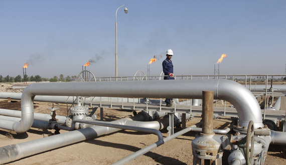 A worker walks at Nahr Bin Umar oil field, north of Basra, southeast of Baghdad.