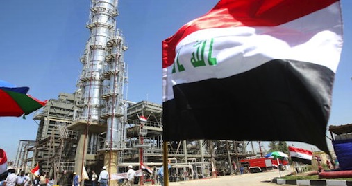 The Iraqi flag flies near an oil refinery in Dora. 