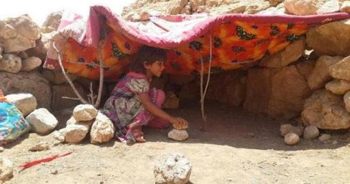 yazidi_child_shelter_sinjar_sun_rocks