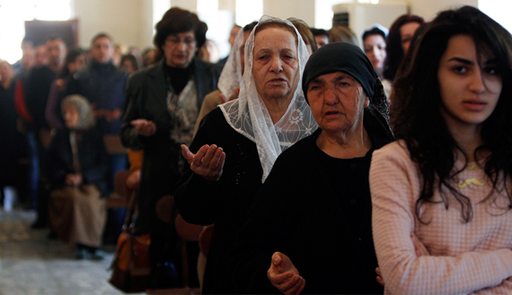 Iraqi Christians attend a mass at Sacred Heart Catholic Church in Baghdad 
