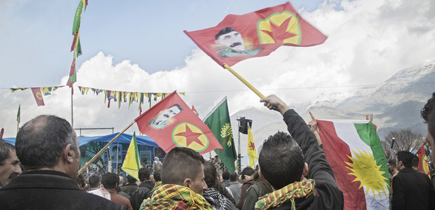 22/03/15 -- Qandil, Iraq -- Crowd cheering and waving PKK flags in front of the celebration platform.